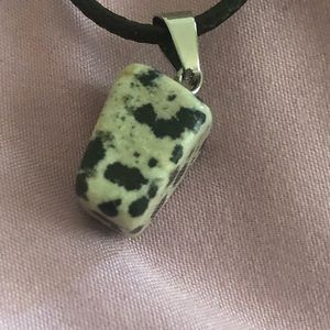 Black/white natural stone with chain.